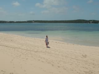 Brand Center | Beach: Lady walking on beach | MYOUTISLANDS.COM